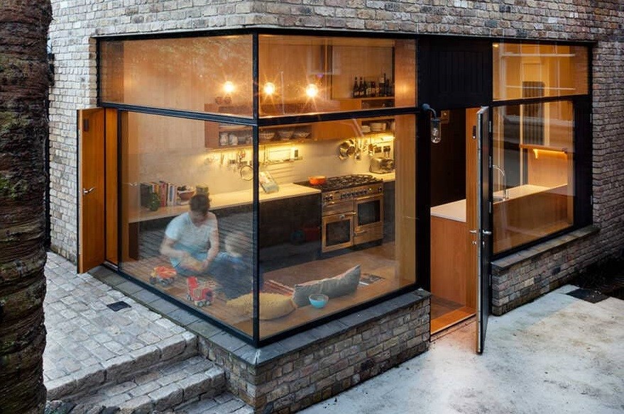 The new ‘Brick Addition’ extension allows a new opening to connect the ground floor reception rooms to the new kitchen within while connecting on to the garden beyond.