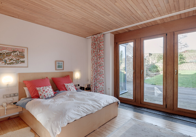 Traditional barn building with contemporary interiors - bedroom