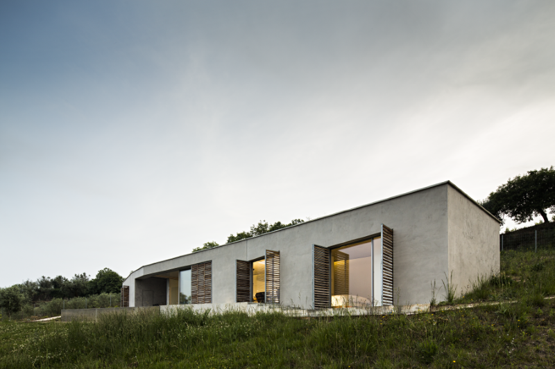 Gateira concrete house designed in harmony with dramatic landscape (6)