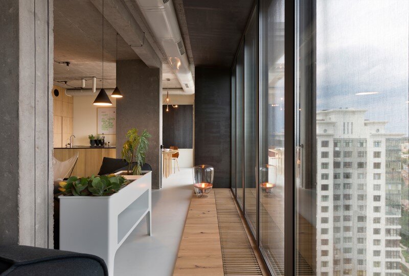 Penthouse with concrete ceiling and a glass-wall windows (10)
