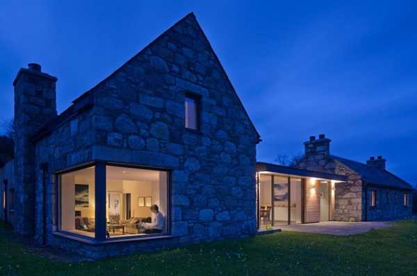 Scottish cottage nestled on a hillside with panoramic views