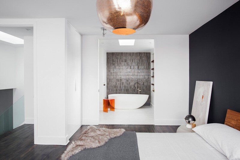 Interiors designed in a smoked grey palette with warm walnut accents and soft white walls (13)