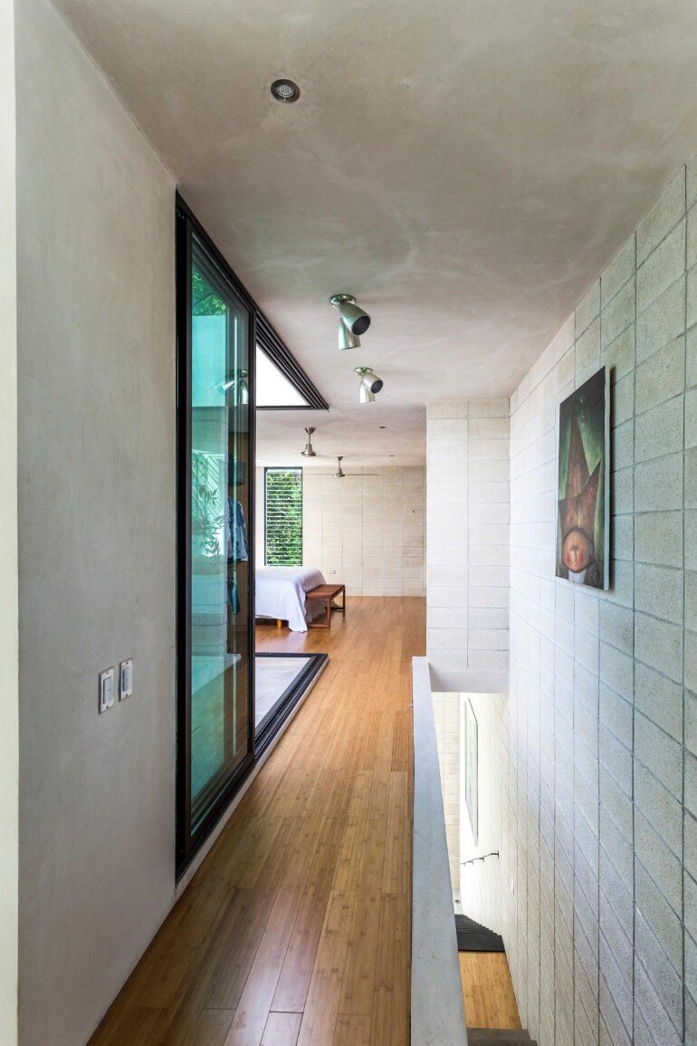 Raw House - Maximizing Vertical Space and Light on a Narrow Lot (13)