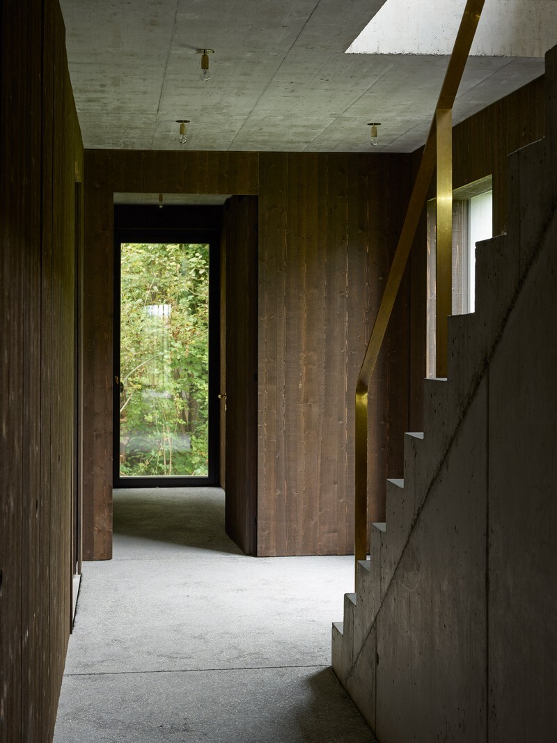 The Architecture of This Family House Combines Raw Concrete with Dark Wood (9)