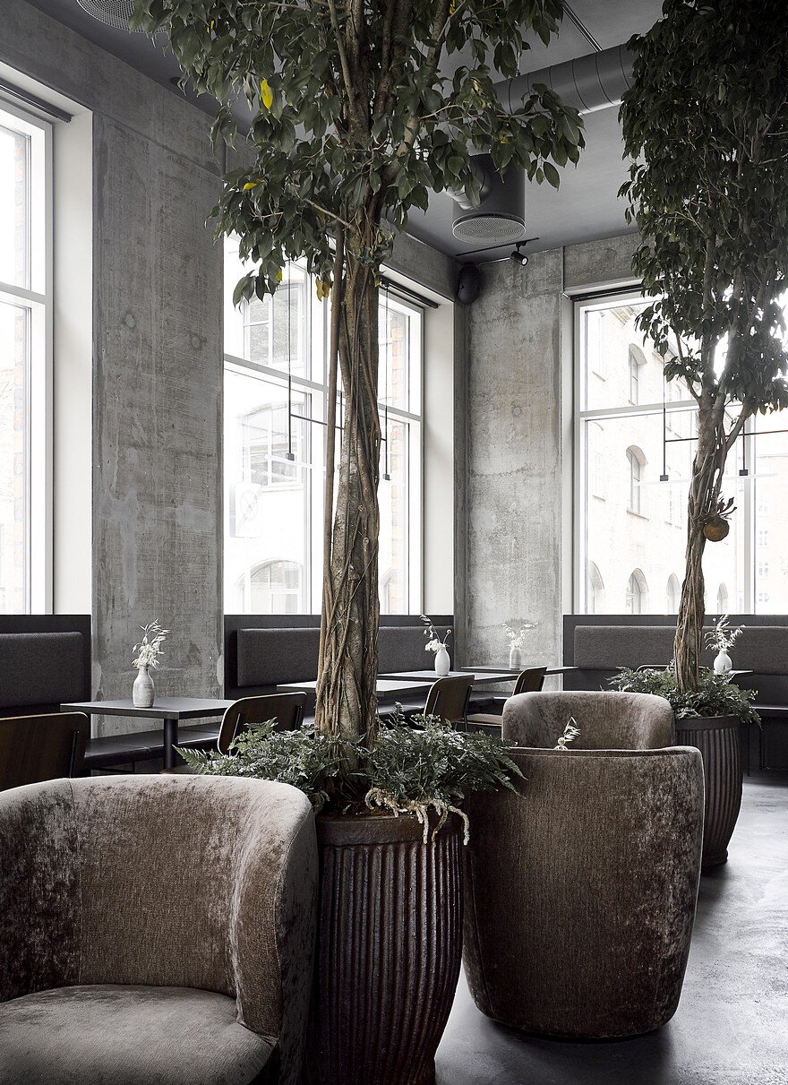 Copenhagen Restaurant Exhibiting Warm and Material Richness Against Raw Concrete Walls 5