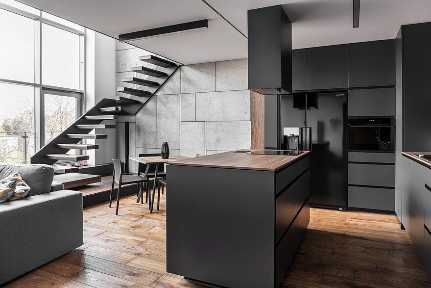 Instantly Captivating Wood and Graphite Apartment in Poznan by Metaforma