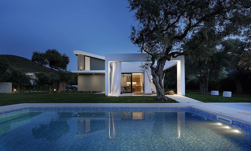 L-Shaped Villa Featuring Large Openings, Clean Surfaces and Bohemian Luxury 15