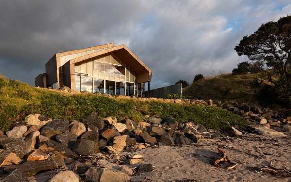 Rusted Steel Cladding House with Crafted Interior Finishes