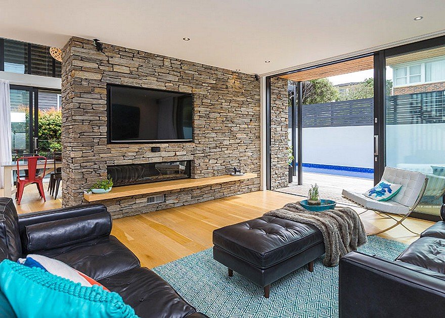 Stylish Contemporary Home with Living Spaces Separated by a Schist Stone Wall 3