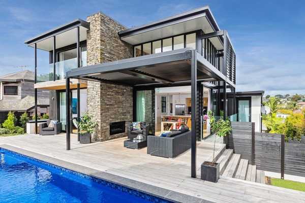 Stylish Contemporary Home with Living Spaces Separated by a Schist Stone Wall 1