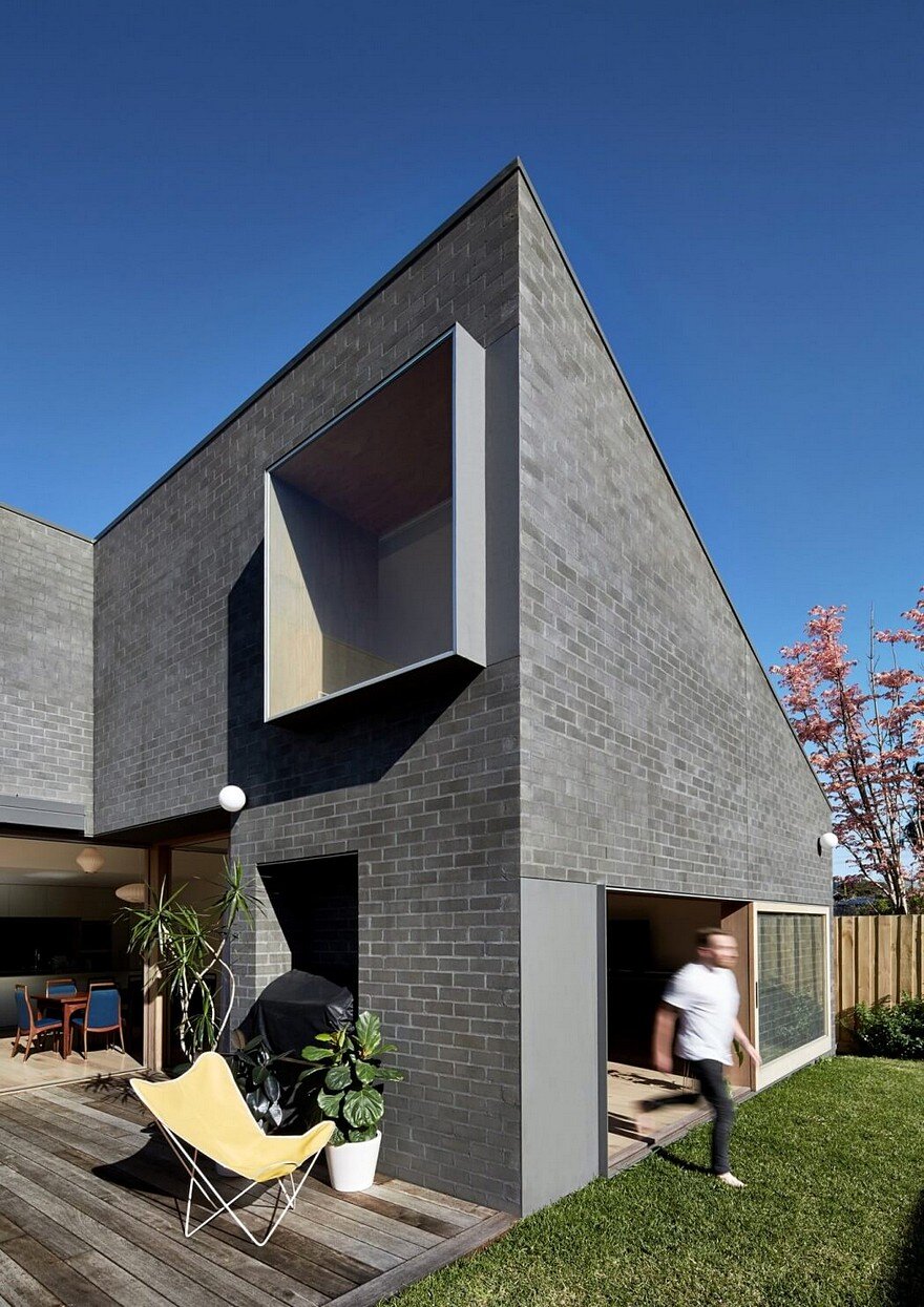 This Black Brick House Features Generous Spaces with a High Degree of Flexibility