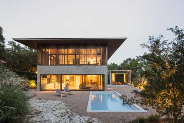 Balcones House is Like a Glass Pavilion Rising from a Solid Concrete Base