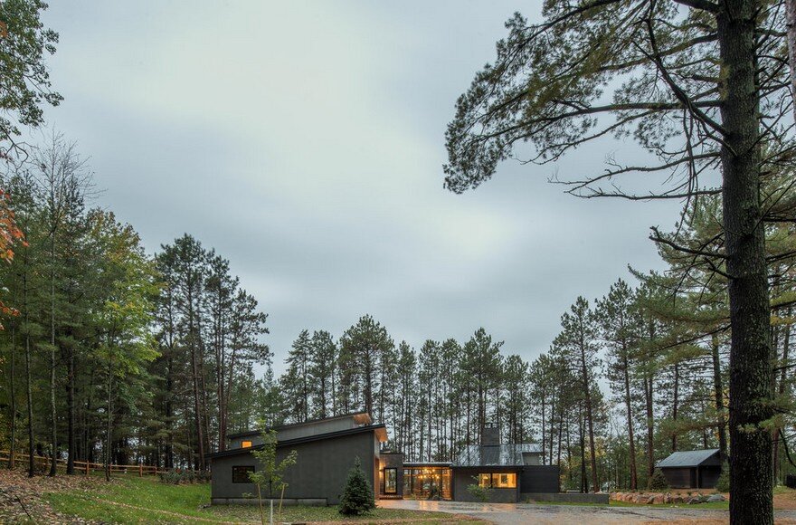 Northern Lake Home Blends into the Forested Landscape