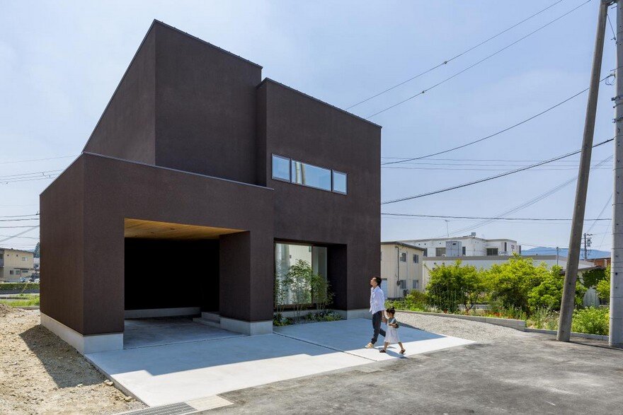 Box-Shaped Japanese Home with Warm Minimalist Interior Design