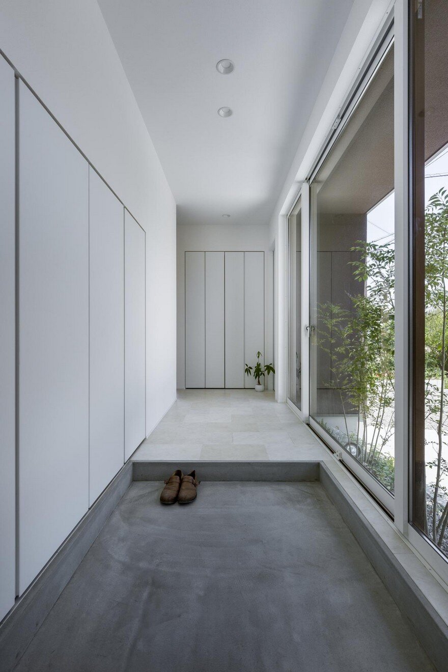 Box-Shaped Japanese Home with Warm Minimalist Interior Design 2