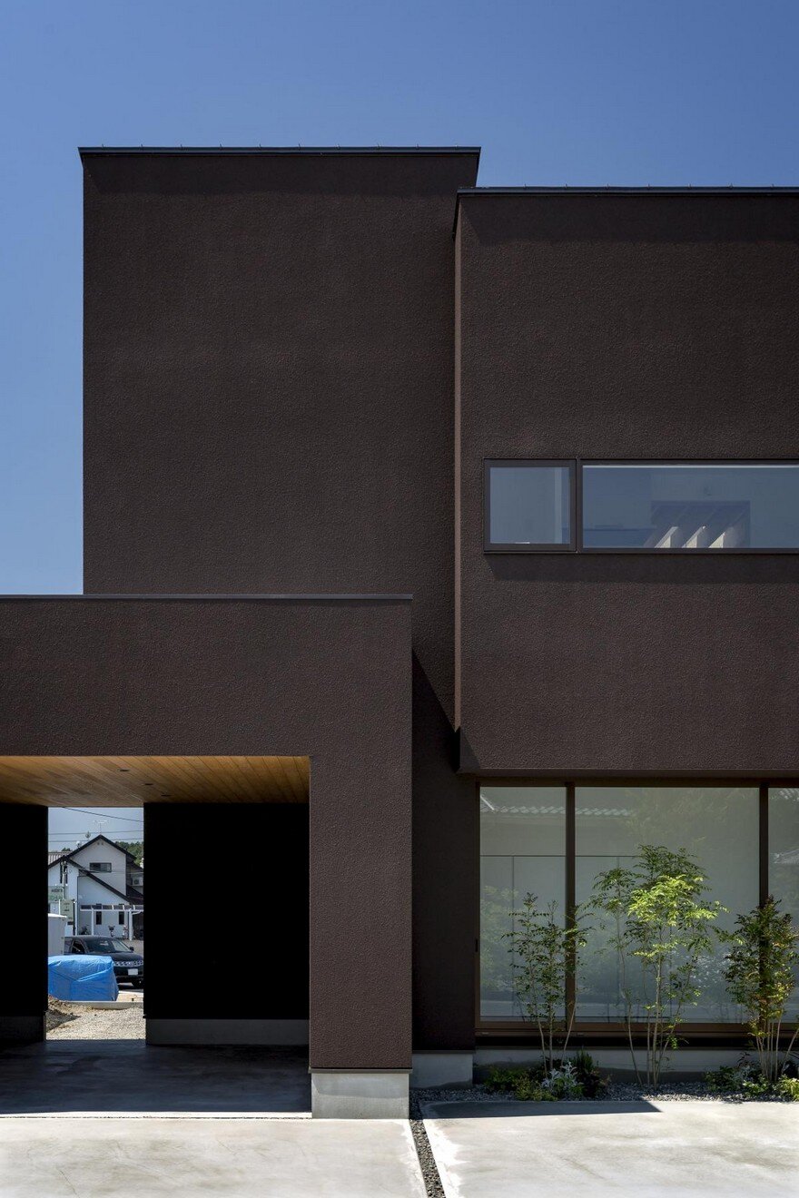Box-Shaped Japanese Home with Warm Minimalist Interior Design 1