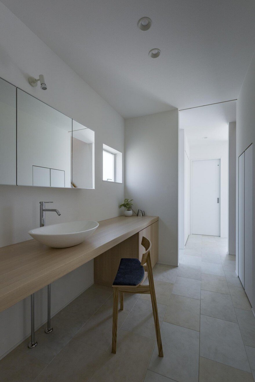 Box-Shaped Japanese Home with Warm Minimalist Interior Design 10