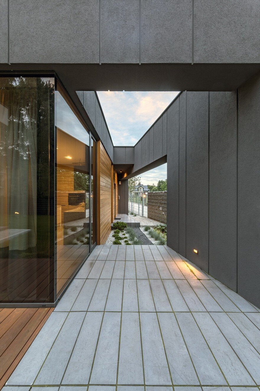 L-Shaped Family Home Exhibiting A Distinctive Roof And Custom Interior 9