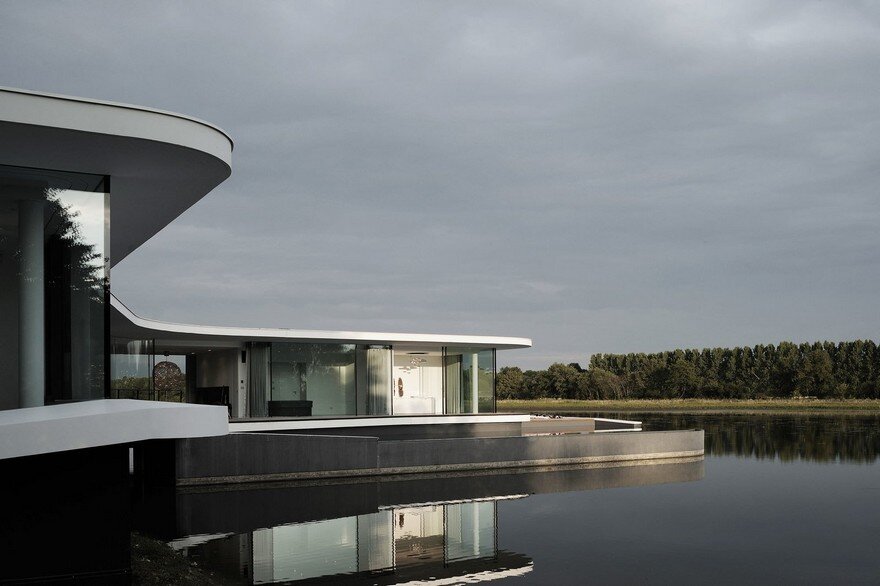 Concrete and Glass Residence Built on the Surface of a Lake: White Snake House 1