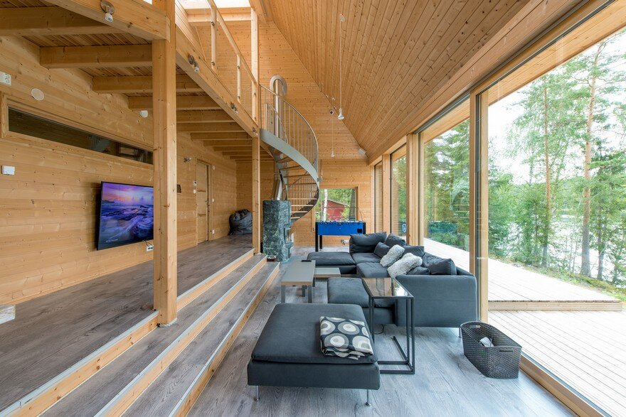 A Finnish Retreat Features a Pyramidal Roof and a Glass Wall Facade 5