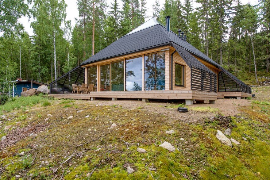 A Finnish Retreat Features a Pyramidal Roof and a Glass Wall Facade