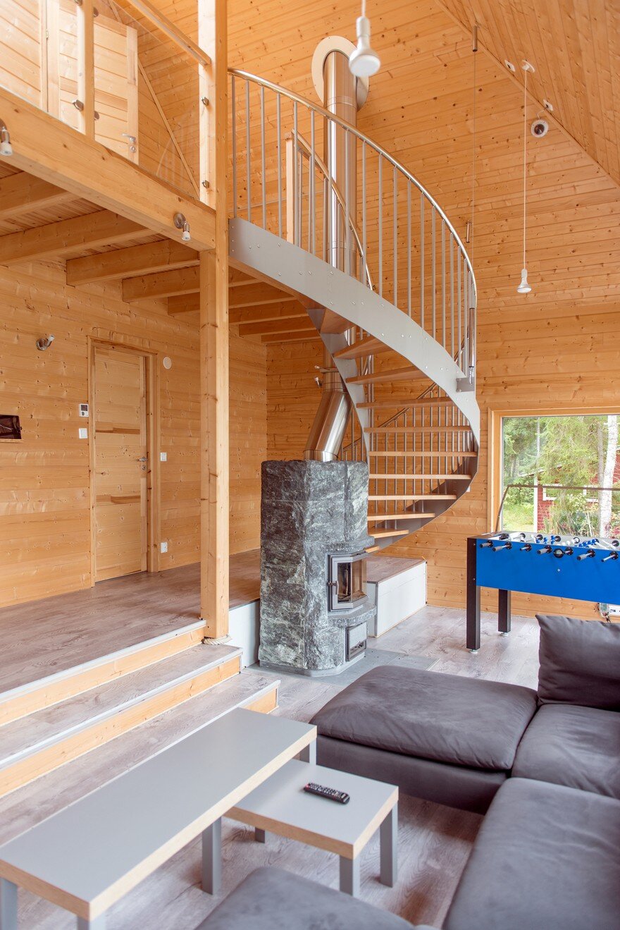A Finnish Retreat Features a Pyramidal Roof and a Glass Wall Facade 6