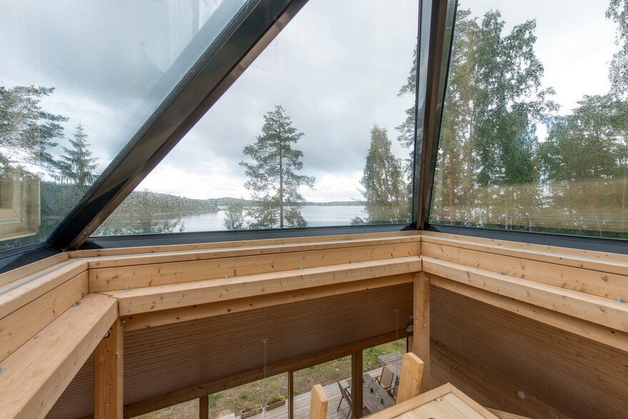 A Finnish Retreat Features a Pyramidal Roof and a Glass Wall Facade 12