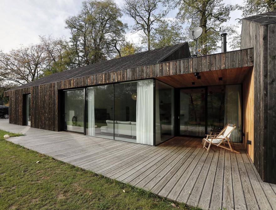One-Story Family House Covered with Charred Larch Planks 1