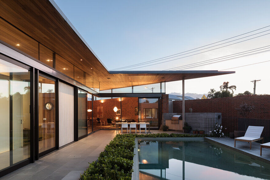 Walled Courtyard House Organised Around a Central Pool 13