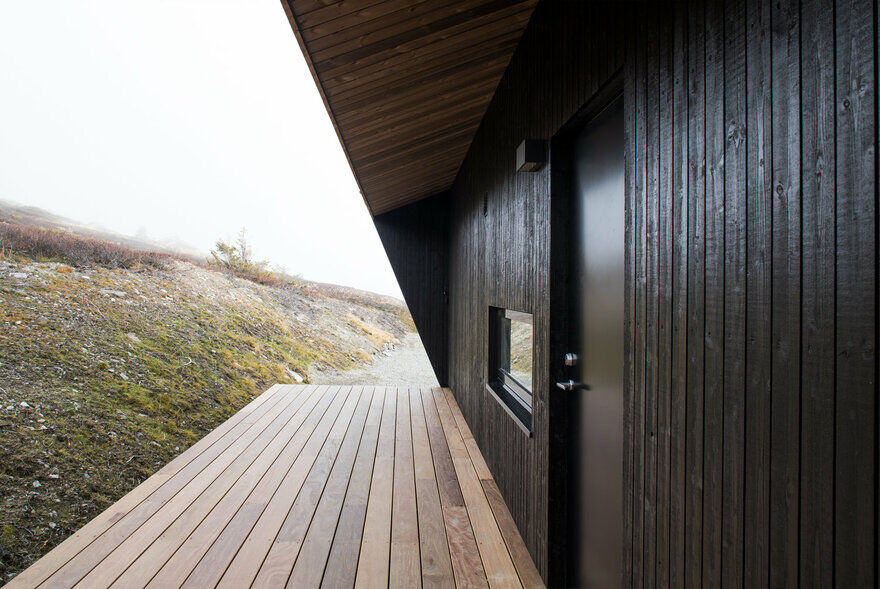 Norwegian Mountain Cabin with a Distinctive, Hood-Like Roof