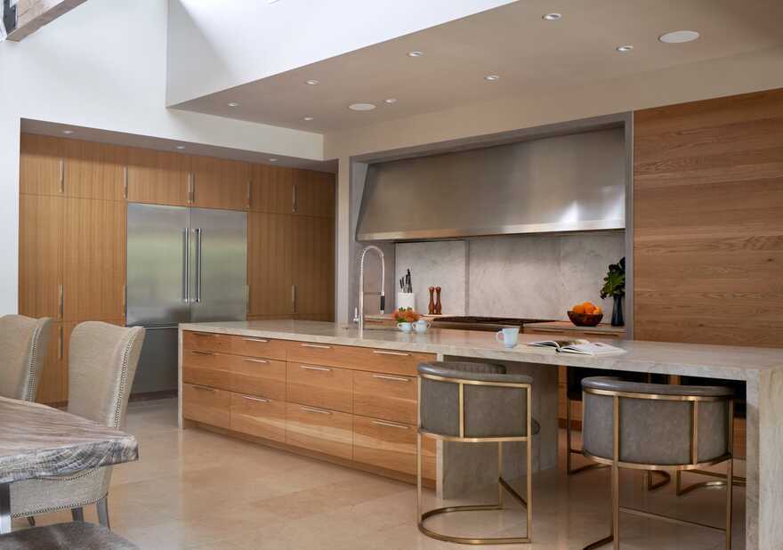 kitchen, granite counters, stone slab backsplashes, wood cabinets, range hood, ceramic tile floors, Texas / Dick Clark + Associates