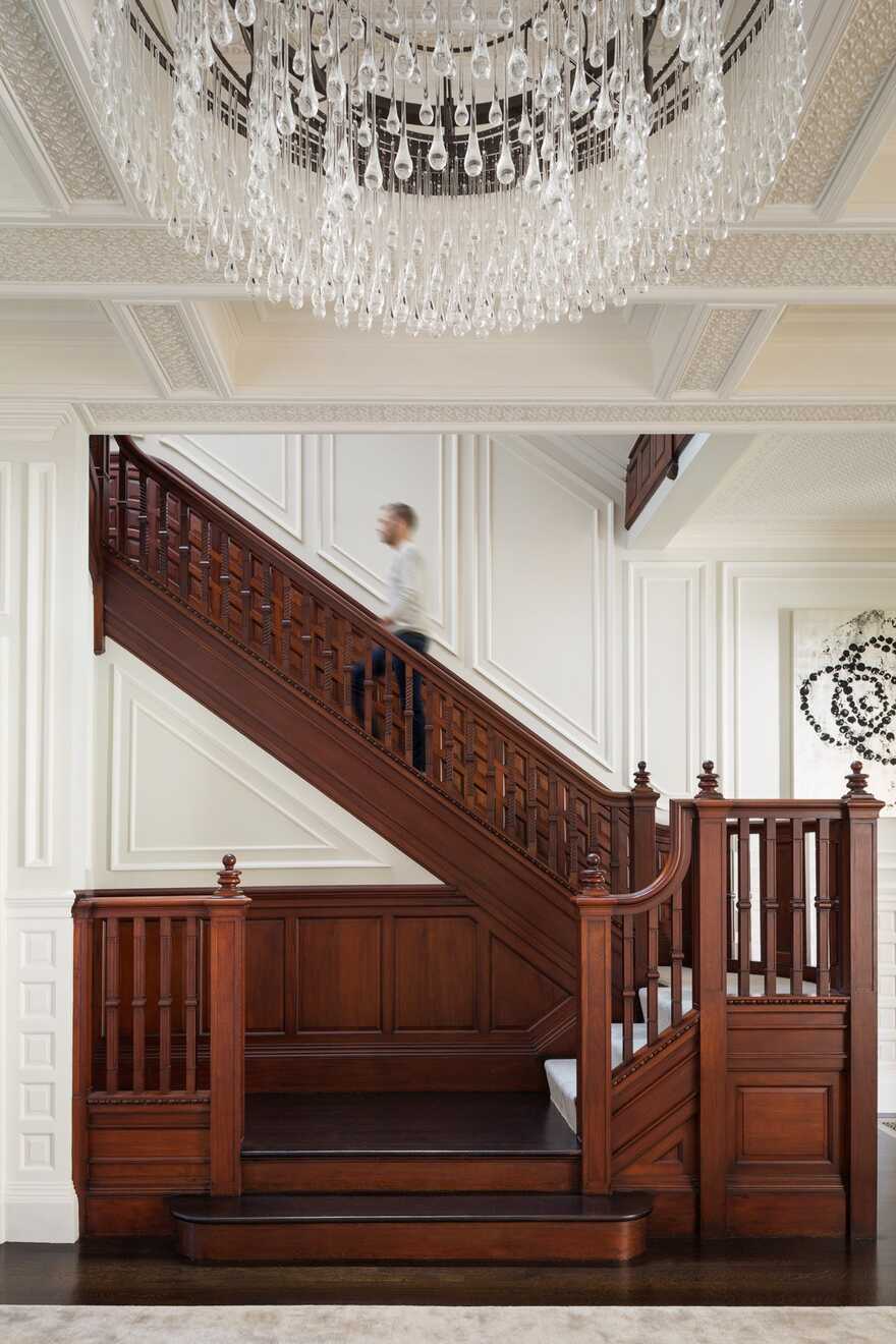 oak staircase by Hacin + Associates