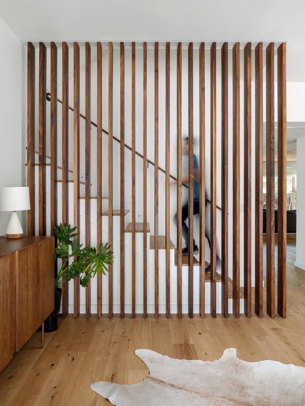 entry vestibule featuring walnut screen element, staircase, Clark Richardson Architects