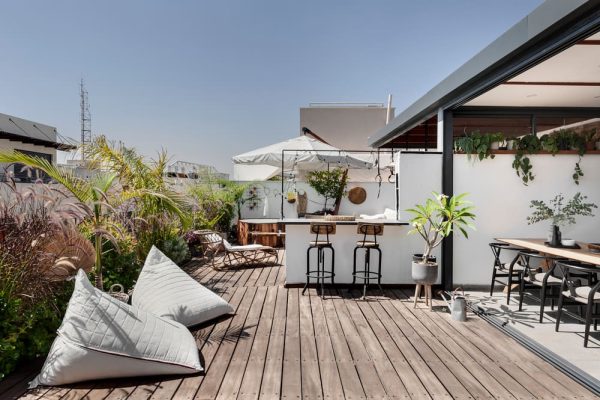 A Rooftop Apartment Overlooking Two Cities