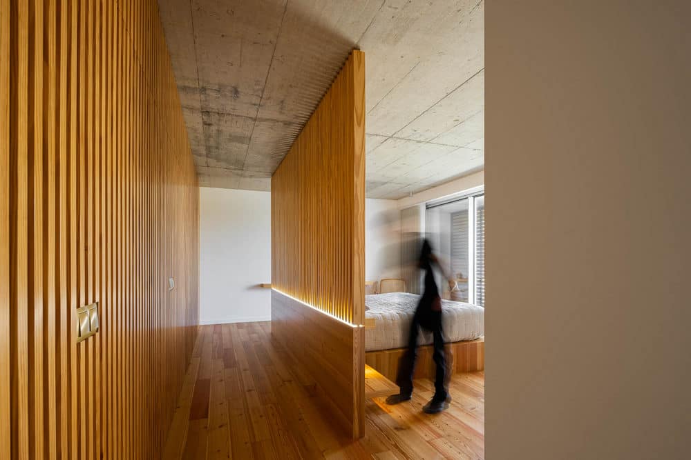 Concrete and Riga Wood Create Interior Confort in a Rural House