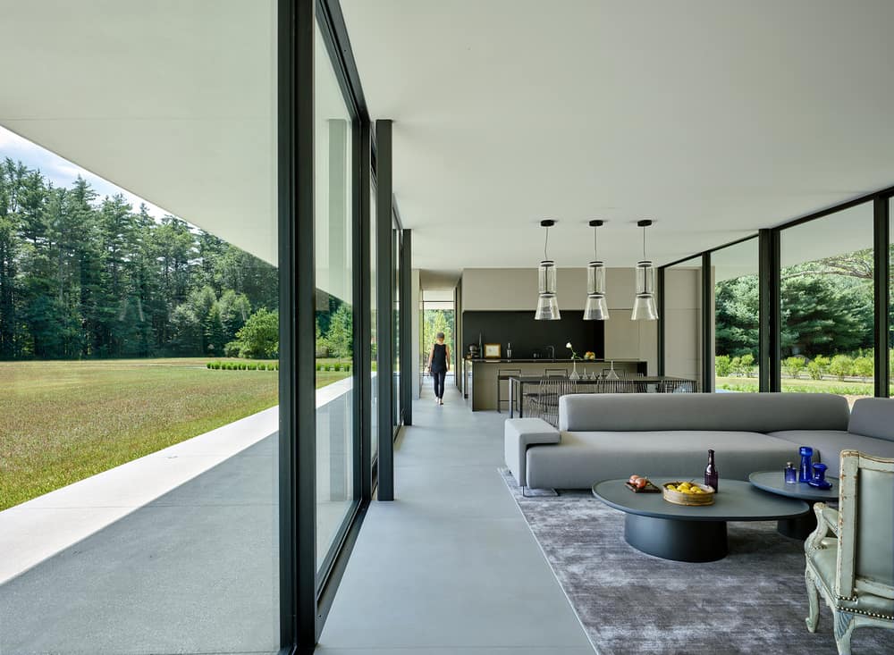 Minimalist Glass House Dots a 9 Acre Grass Field in Berkshires, MA